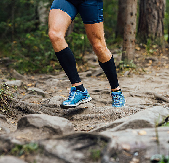 Man wearing running compression socks.